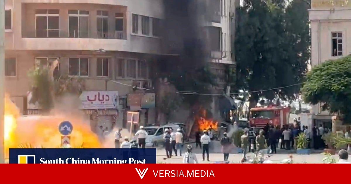 Explosions rock Damascus as France’s Macron visits Syria